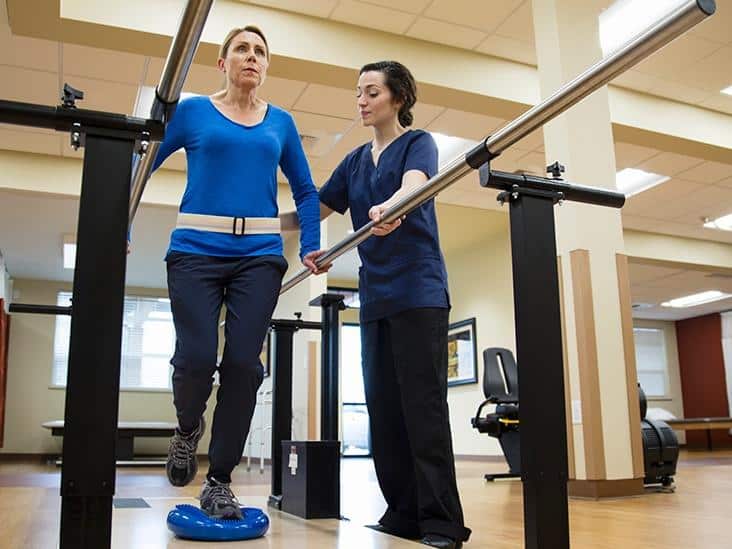 Woman doing physical therapy with an occupational therapist